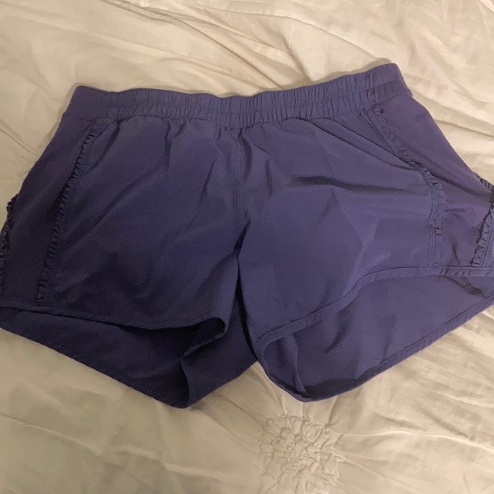 Purple lululemon shorts with ruffle down the sides